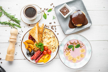delicious breakfast. coffee, crepes and porridge for breakfast. breakfast on a white background
