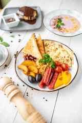delicious breakfast. coffee, crepes and porridge for breakfast. breakfast on a white background