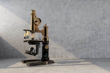 old retro microscope illuminated by ray of light