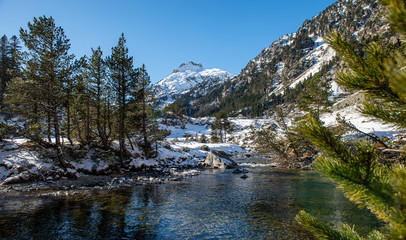 Fototapeta na wymiar river in the snowy Pyrenees mountains, France