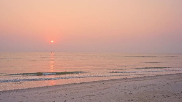 Amazing golden hour sunset at shore with beautiful sky with altocumulus castellanus clouds and dramatic light
