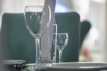 Empty wine glass on the table in a cafe or restaurant. Selective focus