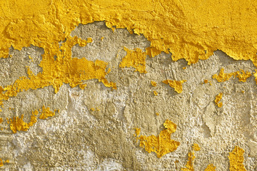 Naklejka premium Old weathered painted yellow color peeling wall grunge background