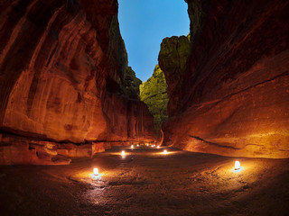 The Siq canyon in Petra during night walk, Jordan, Middle East