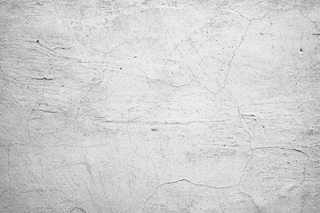 Texture of a concrete wall with cracks and scratches which can be used as a background