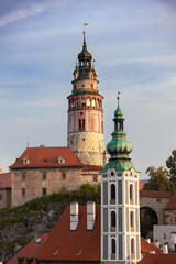 Fototapeta na wymiar Beautiful portrait view to church and castle in Cesky Krumlov at sunrise, Czech republic