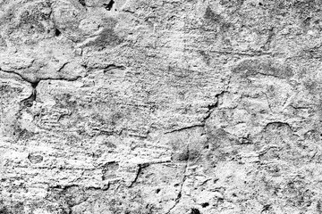 Texture of a concrete wall with cracks and scratches which can be used as a background