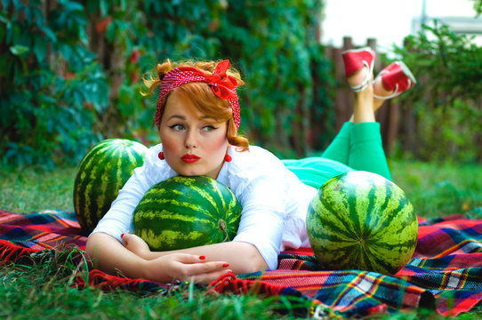 horizontal photo of a pin-up girl with watermelons