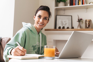 Optimistic cheerful beautiful brunette woman