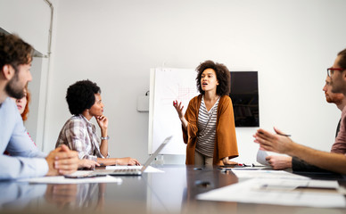 Collaboration and analysis by business people working in office