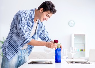 The man alone preparing for romantic date with his sweetheart