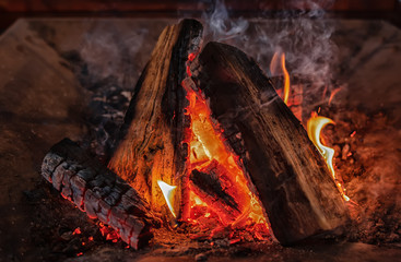 The burning coals for a barbecue in a brazier a close-up view