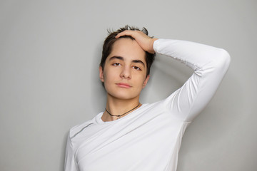 Studio portrait of beautiful smiling young man.