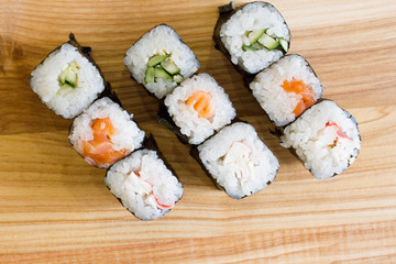 Fresh and delicious rolls, sushi and Japanese cuisine. rolls with salmon, avocado, cucumber, flying fish ROE and cream cheese inside. Sushi menu. Flatley food. the view from the top.