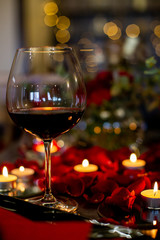 close-up vertical photo of a glass with red wine
