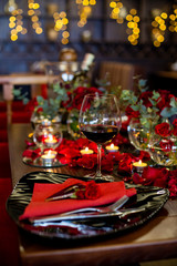 a glass of red wine is on the table