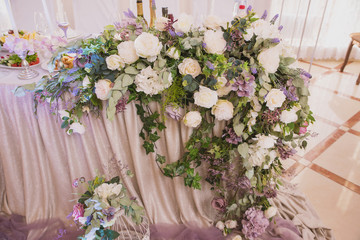 Decoration of the Banquet with vases of flowers and flower arrangements