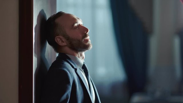 Pensive bearded male thinking having business problem. Shot on RED Raven 4k Cinema Camera