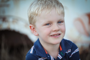 Close up portrait image of cute smiling Caucasian boy