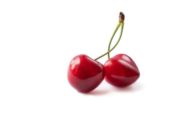 Fresh red cherry isolated on white. Cherry fruit with copy space for text. Sweet cherry isolated on white background cutout. Various summer berries. Two fresh cherries on white background.