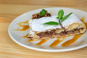 a piece of apple strudel on the plate