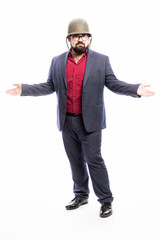 A man with a beard in a military helmet and in a strict suit. White background. Vertical.