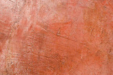 Orange grunge texture of the wall for background.