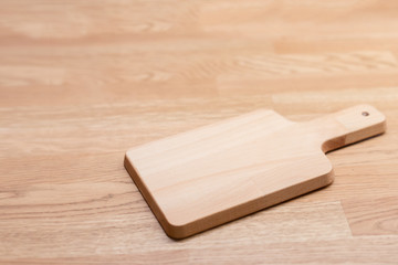 Empty vintage cutting board on wooden background. food background concept