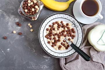 Wholegrain chocolate, milk balls and milk. Healthy cereal breakfast. Baby breakfast. Baby eating. Balanced diet. The top view