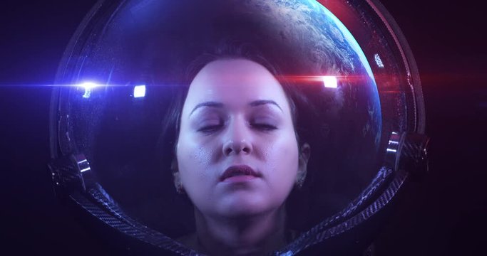 Young Fearless Beautiful Female Astronaut Exploring The Infinite Space. She Is Exploring Outer Space In A Space Suit. Science And Technology Related 4K Concept Footage.
