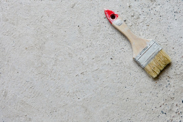 Used large paint brush on concrete background