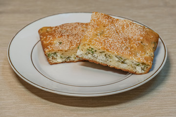 homemade pie with feta cheese and herbs close up