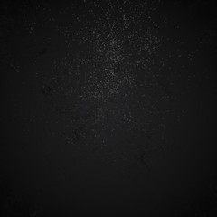 Freeze motion of white powder exploding, isolated on black, dark background. Abstract design of white dust cloud. Particles explosion screen saver, wallpaper with copy space. Planet creation concept