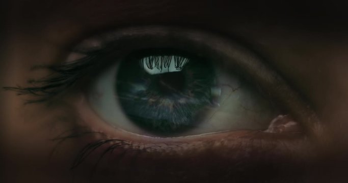 Female Racer in helmet. Macro shot of the eye with road reflections.