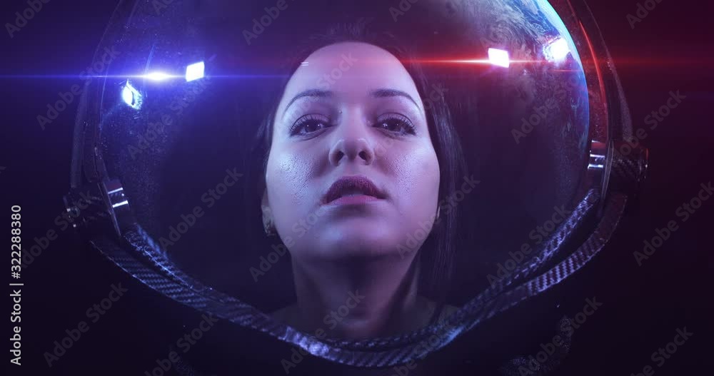 Wall mural young fearless beautiful female astronaut exploring the infinite space. she is exploring outer space