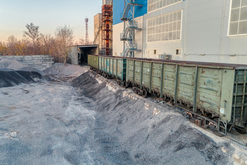 A platform for unloading inert materials from freight railway cars.