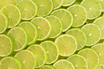 Fresh lime slices as a background.