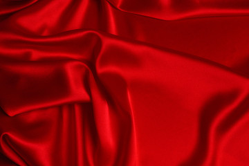 Obraz premium Red silk or satin luxury fabric texture can use as abstract background.