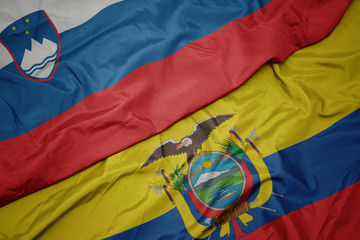 waving colorful flag of ecuador and national flag of slovenia.