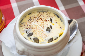 Pumpkin soup recipe in the white bowl for healthy food concept background