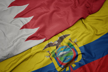 waving colorful flag of ecuador and national flag of bahrain.