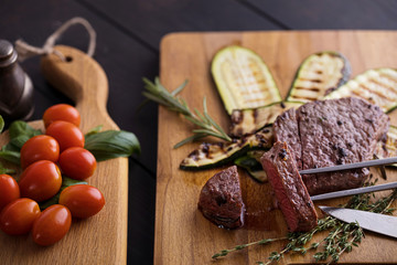Top view ribeye beef steak with vegetables