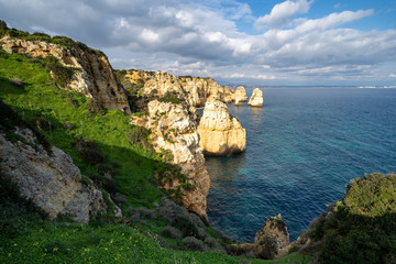 Fototapeta na wymiar Scenic natural cliff formations of Algarve coastline with turquoise water at Ponta da Piedade, in Algarve Portugal