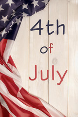 Fototapeta na wymiar 4th of July, the US Independence Day, place to advertise, wood background, American flag, United States of America