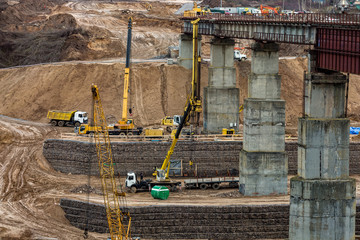 construction or reconstruction of highway concrete bridge over a wide river. construction...