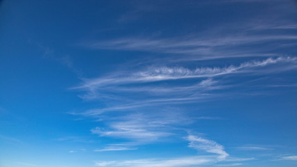 blue sky background with white clouds on a warm summer day