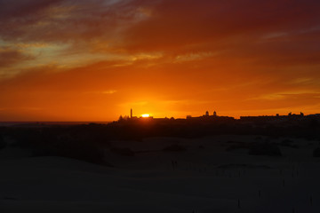  colorful sunset on the Spanish island of Gran Canaria in the Maspalomas dunes