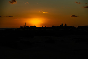  colorful sunset on the Spanish island of Gran Canaria in the Maspalomas dunes