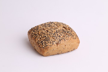 delicious bread rolls on colored background