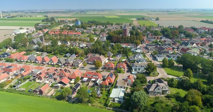 Dutch City Sexbierum, Showing a Neighbourhoord, Both Churches and the Glass Pyramid, Shot Moving Left, Friesland, Netherlands / Holland &ndash; 4K Drone Footage